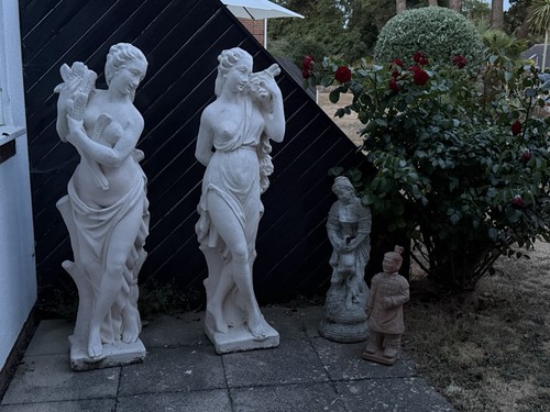 Two concrete statues - two,